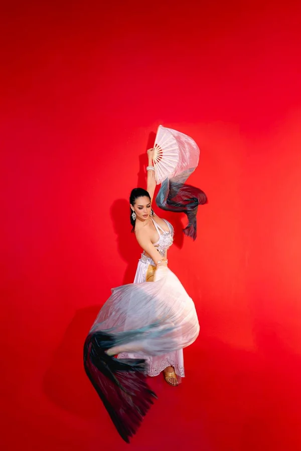 Elegant belly dancer Elma in traditional costume performing in Bali studio